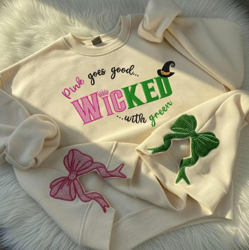 Wicked Glitter Side Bow Embroidered Sweatshirt Wicked Movie Shirt Pink And Green Musical Wizard Of Oz Movie Fans Gift 1763613516027.png