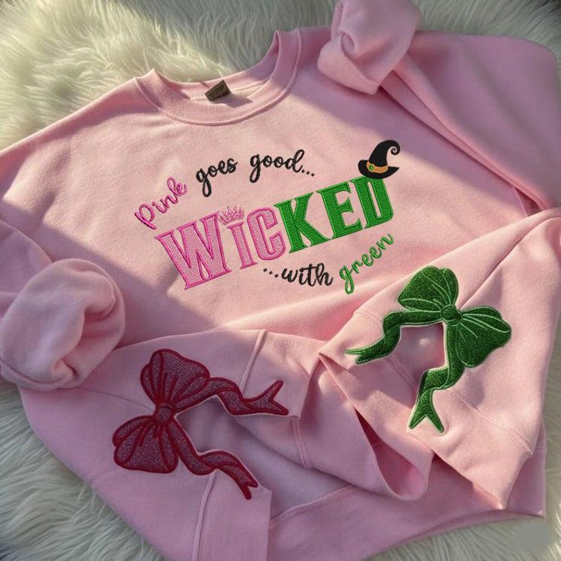 Wicked Glitter Side Bow Embroidered Sweatshirt Wicked Movie Shirt Pink And Green Musical Wizard Of Oz Movie Fans Gift 1763613516099.png