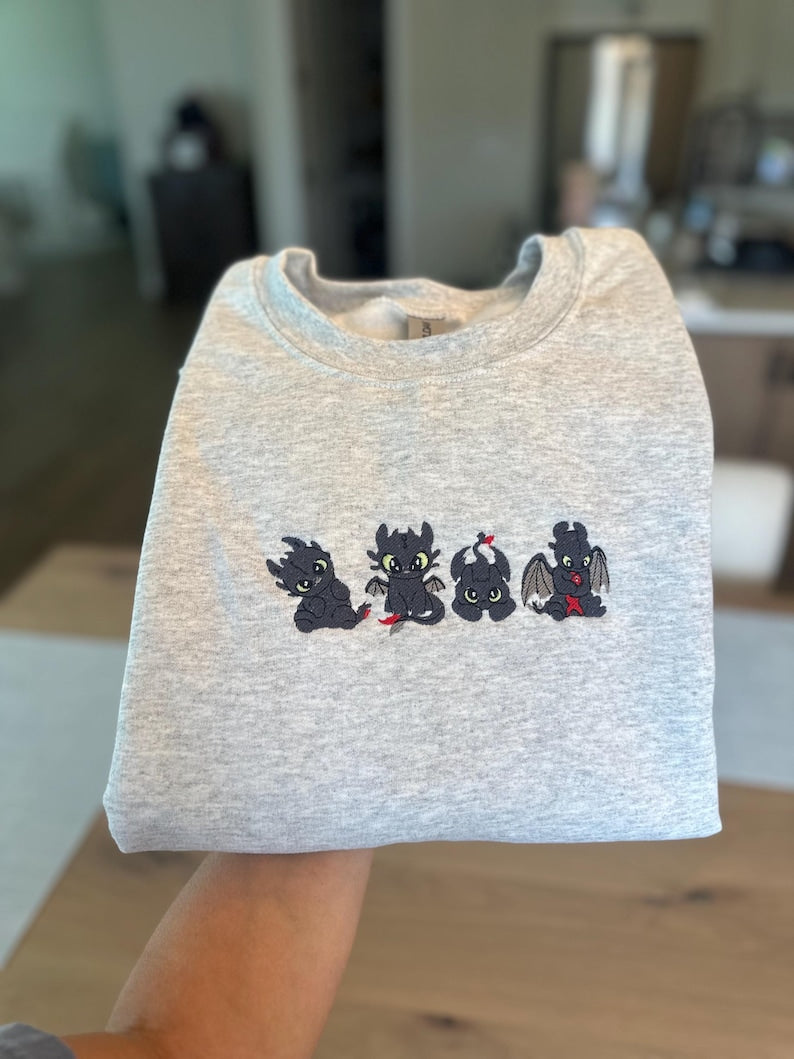 Little Dragons Crewneck Sweater Toothless 1764317826330.jpg