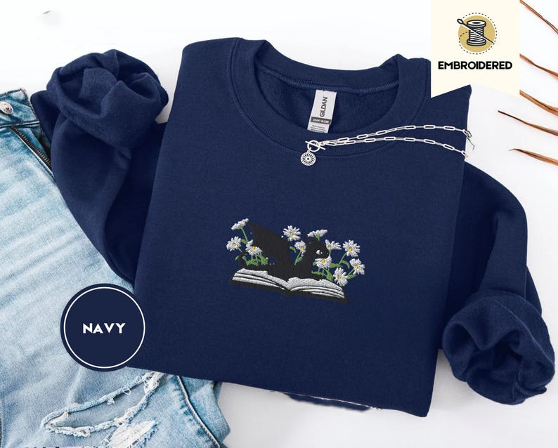 Dragon And Daisies Sweatshirt Cozy Embroidered Book Lover Gift Gildan 18000 1764835588151.png