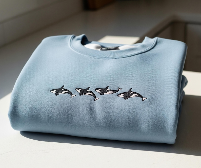 Orca Whale Embroidered Sweatshirt Blue Ocean Pullover Cozy Marine Life Jumper Sea Animal Shirt Gift For Ocean Lovers Unisex Sweater 1765250643827.png
