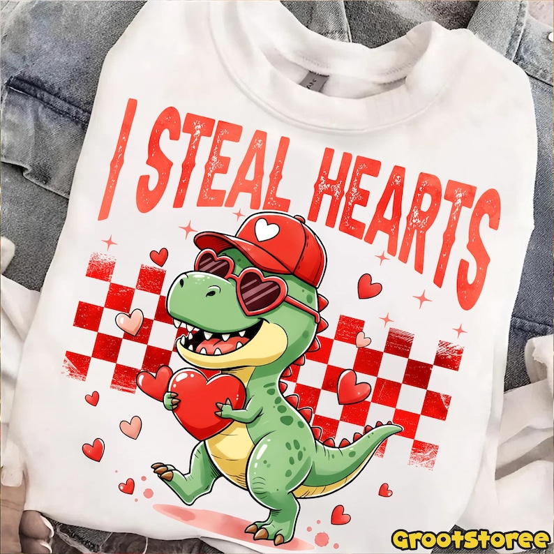 Retro Valentine Dinosaur Holding Heart Shirt Cute I Steal Hearts Vday Shirt Checkered Valentine Shirt Design 1766476058279.png