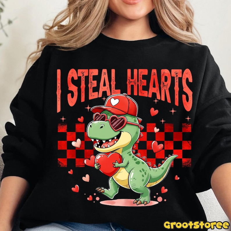 Retro Valentine Dinosaur Holding Heart Shirt Cute I Steal Hearts Vday Shirt Checkered Valentine Shirt Design 1766476058381.png