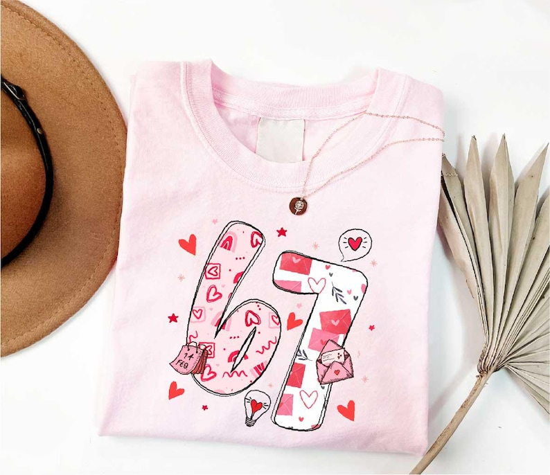Cute 67 Valentines Shirt Cupid Says 67 T Shirt Funny Number Meme Top Happy Valentines Day Sweater Gift For Her Six Seven Love Shirt 1766552002666.png