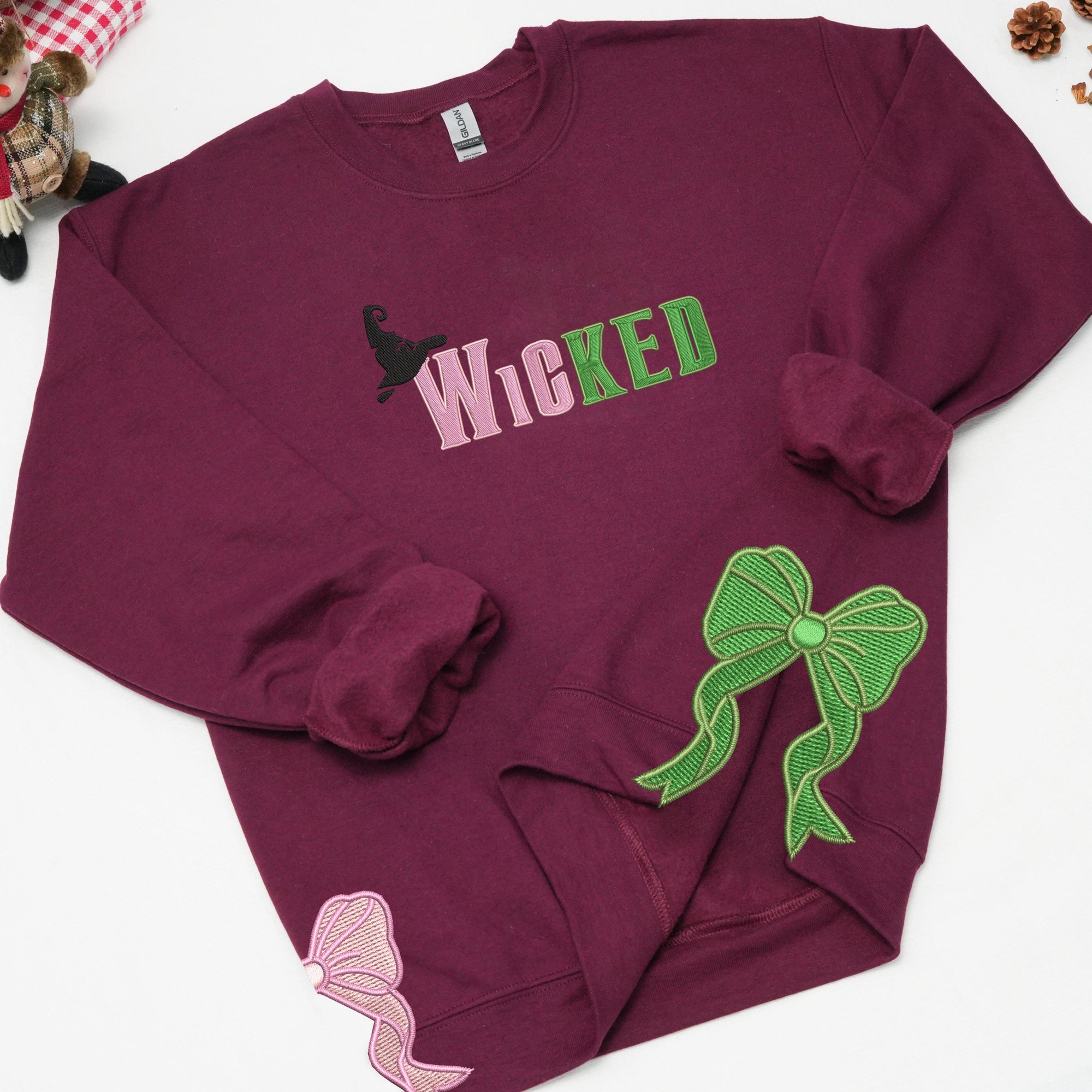 Embroidered Wickeds Sweatshirt, Gift For Fan Of Wizard, Side Bow Sweatshirt 2_f638bed7-b714-4c81-9f2a-2d4428fca76d.jpg