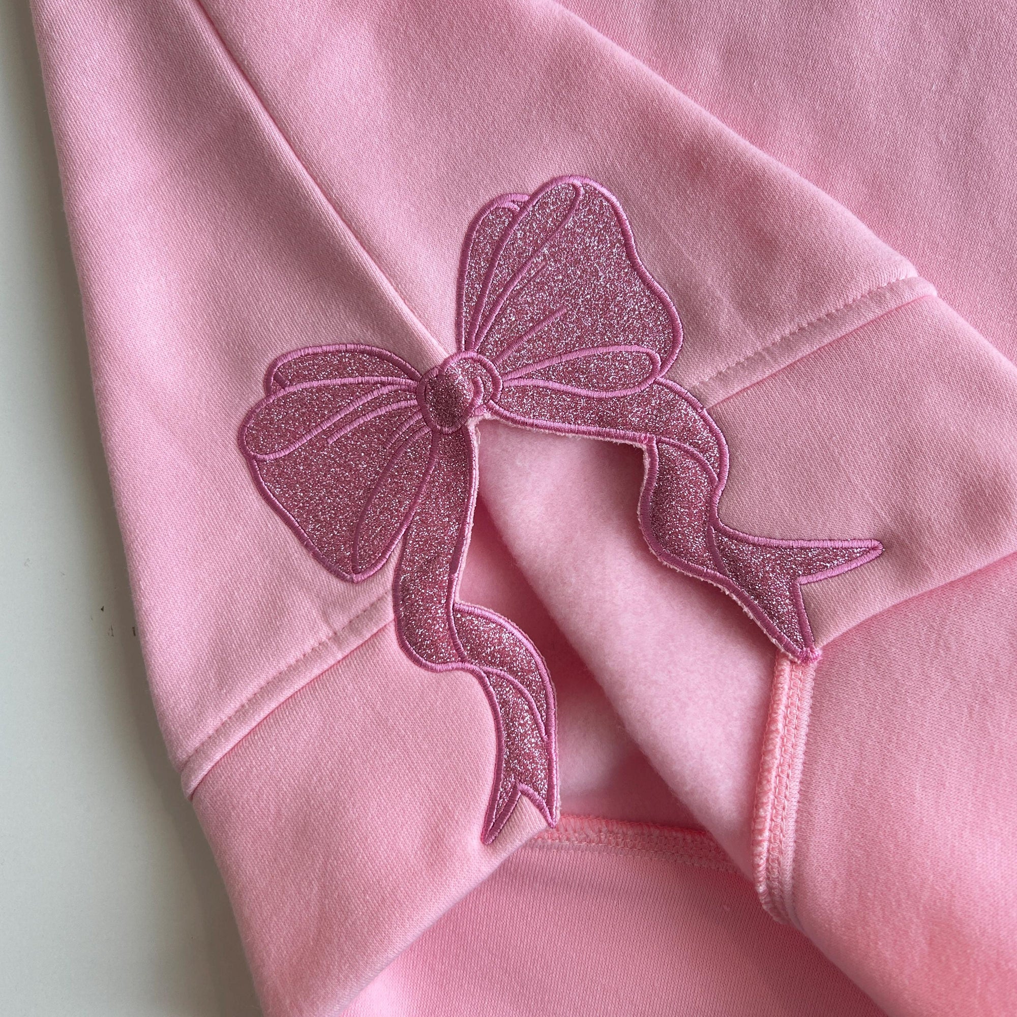 Wicked Side Bow Embroidered Sweatshirt, Wicked Musical Movie Fan Gift, Defy Gravity Crewneck, Christmas Ribbon Side Bow Gift For Her 3_f9857d46-1f47-46b9-bfed-2576366a5453.jpg