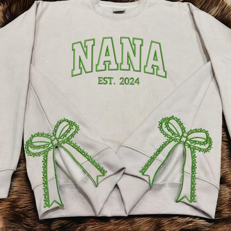 Custom Nana Est Embroidered Christmas Bow Embellished Shirt, Colorful Custom Side Bow Cut-Out Sweatshirt, Christmas Gift Hoodie il_794xN.6377355776_onpp.jpg