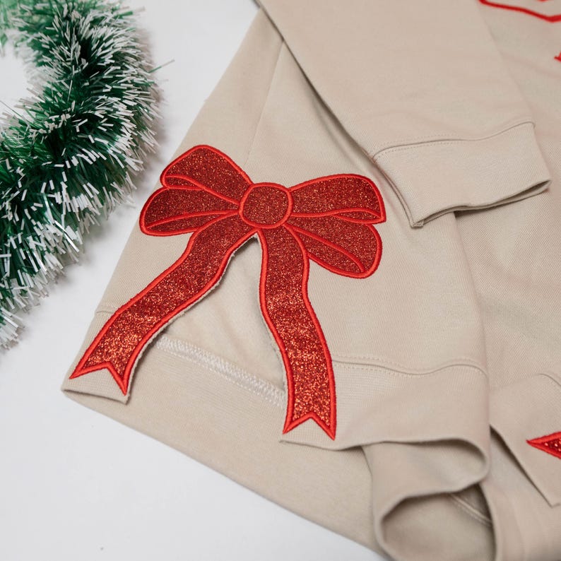 Glitter Gigi Est Claus Embroidered Mimi, Grandma Christmas Bow Embellished Sweatshirt Custom Side Bow Cut-Out Sweatshirt, Christmas Gigi il_794xN.6425160663_l8ca.jpg