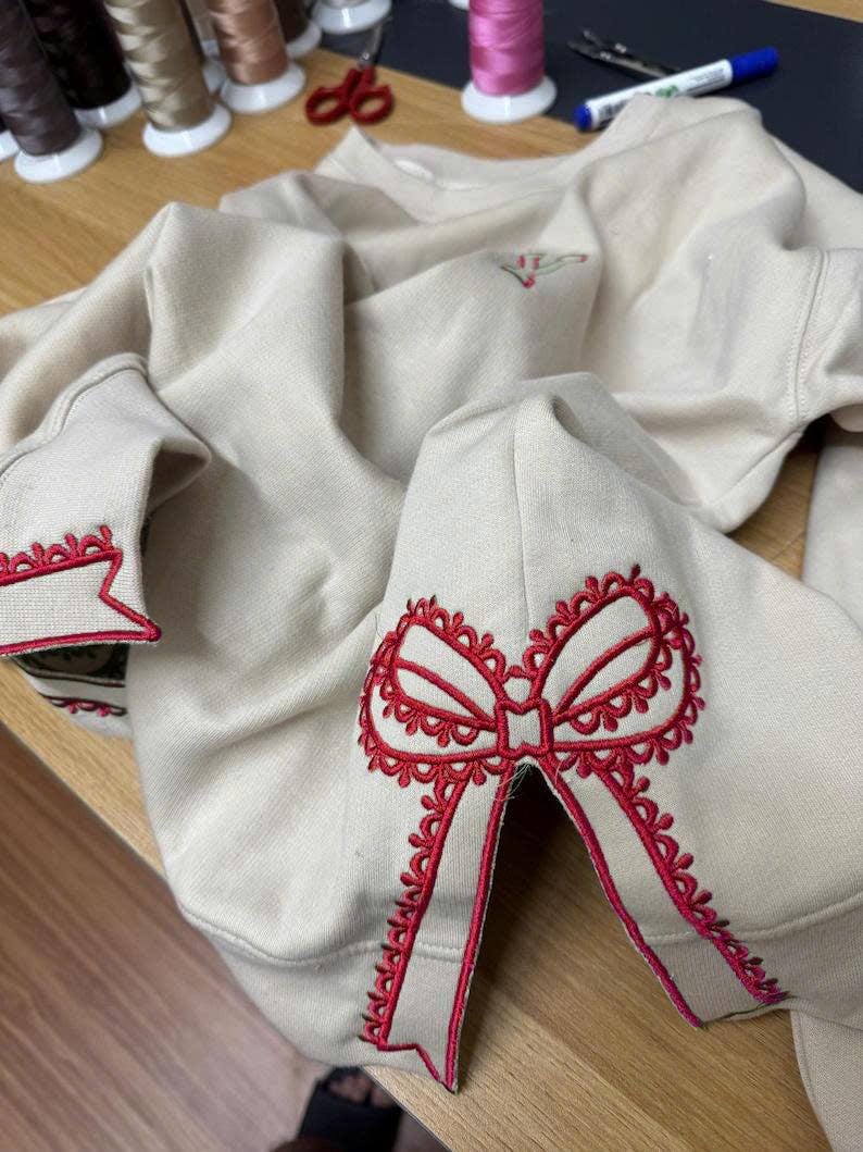 Custom Nana Est Embroidered Christmas Bow Embellished Shirt, Colorful Custom Side Bow Cut-Out Sweatshirt, Christmas Gift Hoodie il_794xN.6425441217_de31.jpg