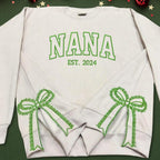 Custom Nana Est Embroidered Christmas Bow Embellished Shirt, Colorful Custom Side Bow Cut-Out Sweatshirt, Christmas Gift Hoodie il_794xN.6425441991_oyrz.jpg