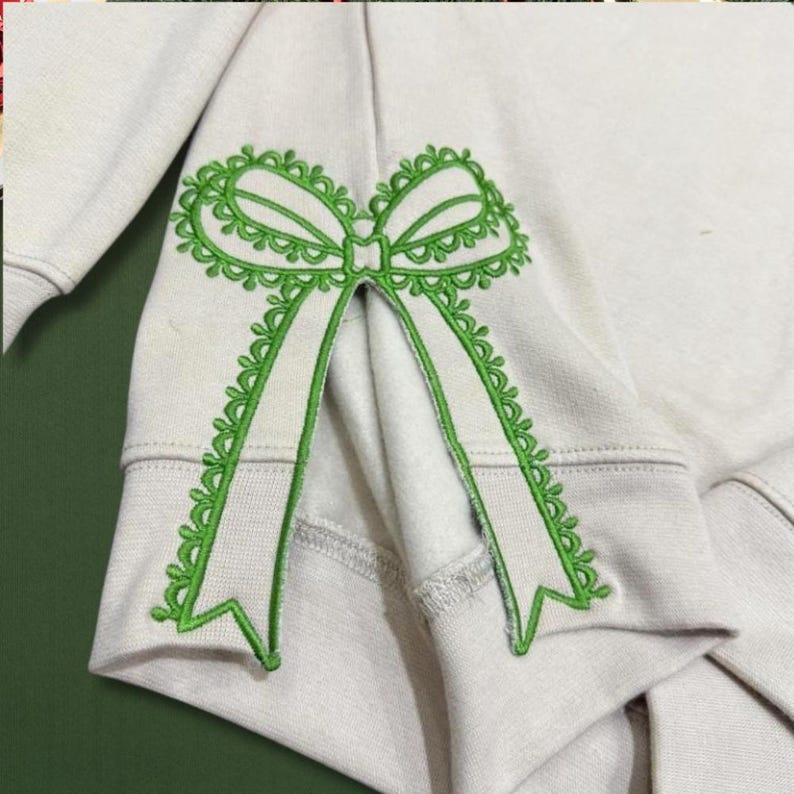 Custom Nana Est Embroidered Christmas Bow Embellished Shirt, Colorful Custom Side Bow Cut-Out Sweatshirt, Christmas Gift Hoodie il_794xN.6425445269_k04i.jpg