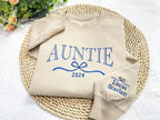 Cute and Trendy Auntie Bow Embroidered Sweatshirt with Kids Name on Sleeve,Personalized Crewneck Pullover, Aunt Sweatshirt, Christmas Gifts il_794xN.6429002610_onlh_1.jpg